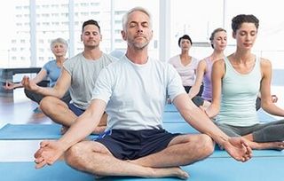 Group of people meditating — Regeneration Station in Lenexa, KS