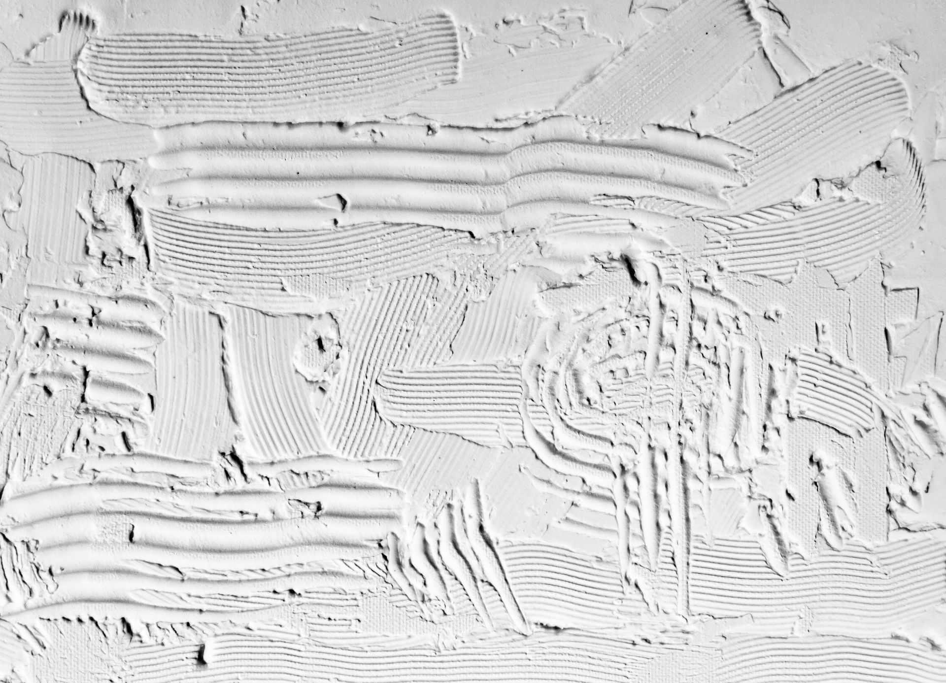 Textured white wall with layered trowel marks.
