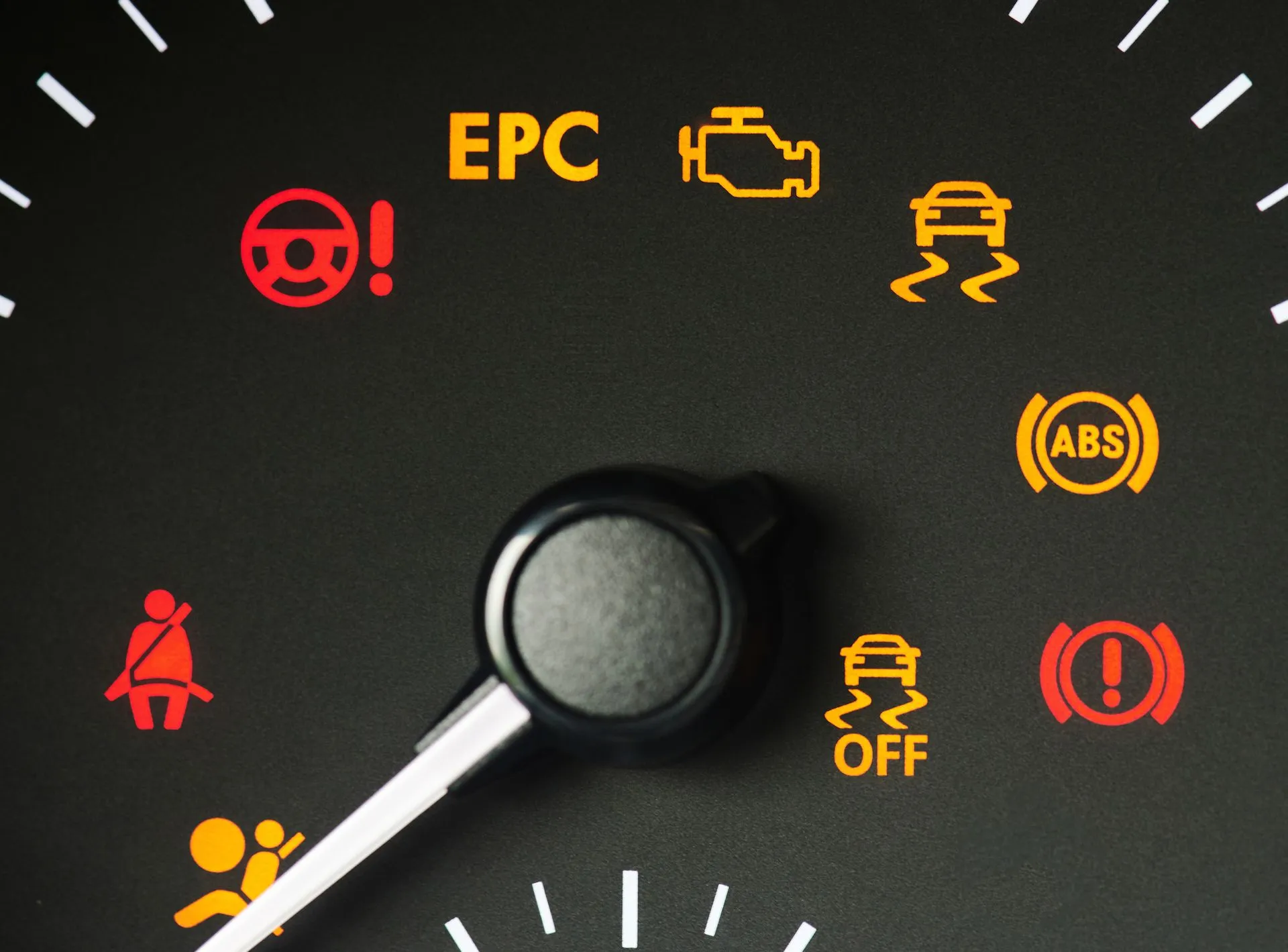 Car dashboard warning lights lit around the steering wheel, including EPC, check engine, ABS, and airbag symbols