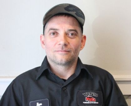 A man wearing a hat and a shirt that says yank on it