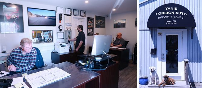 A group of men are sitting at desks in an office.