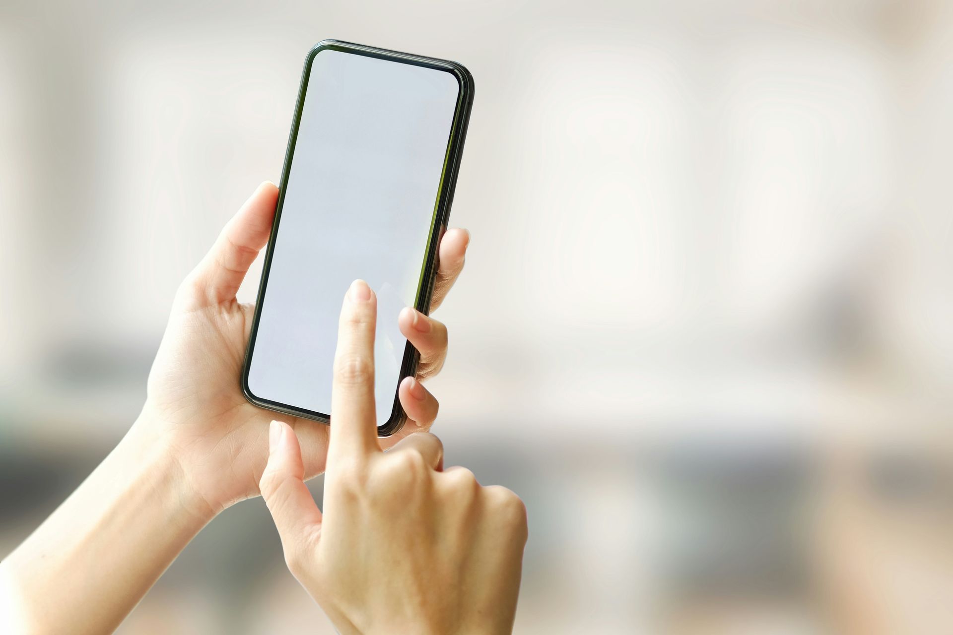 Person using phone to schedule a Myofascial Release appointment in Las Vegas for natural pain relief and relaxation.