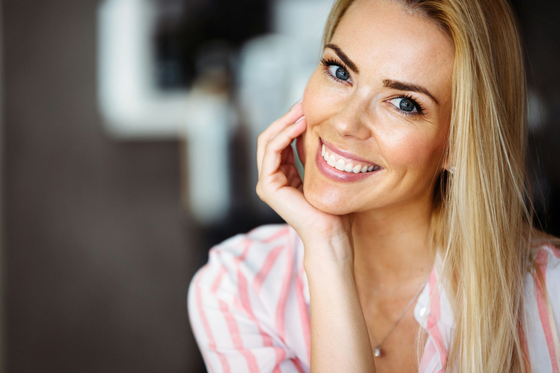 Smiling woman after a Myofascial Release session in Las Vegas experiencing renewed comfort, mobility, and stress relief.