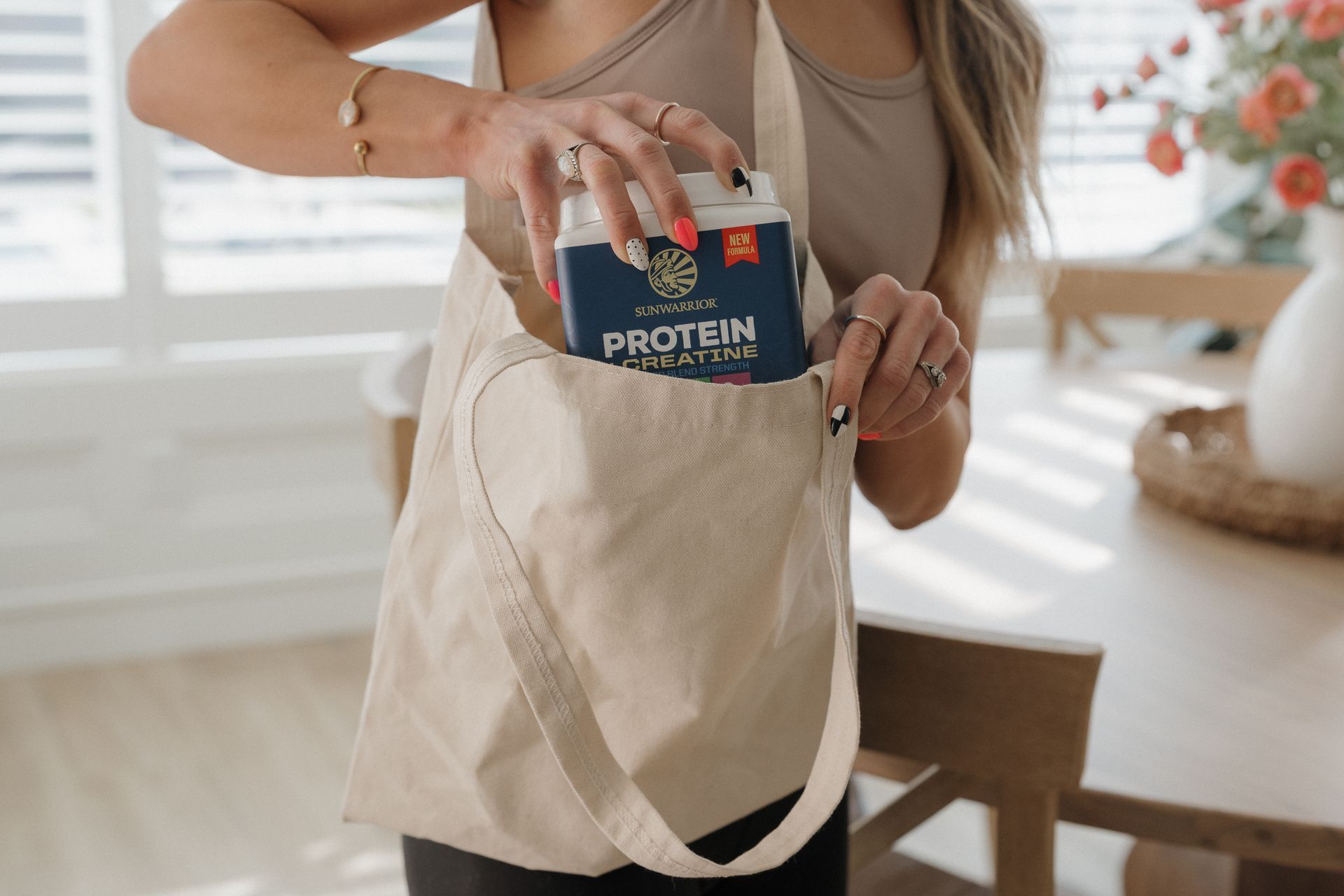 Person holding a blue and white container of