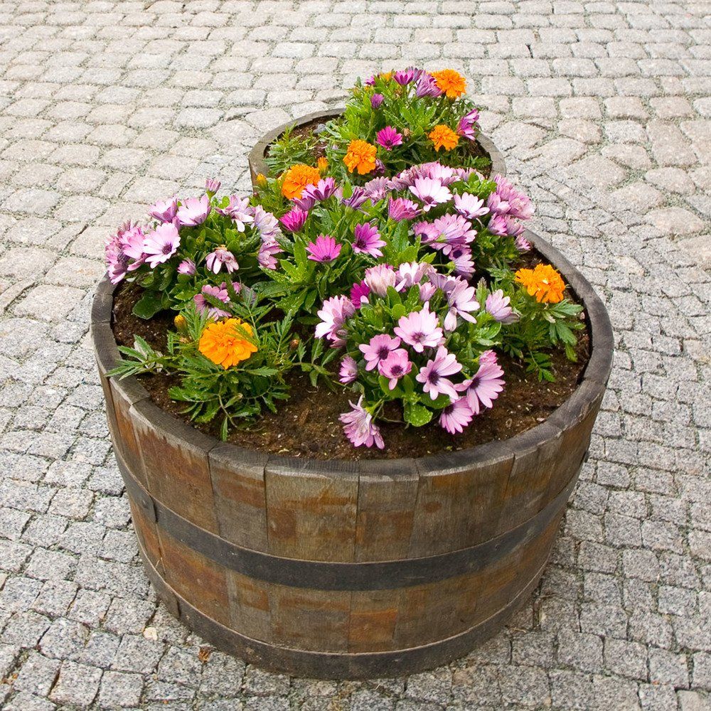 liten blomsterkasse på brostein - Vågen & Hansen