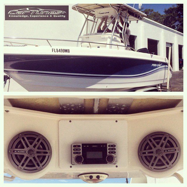 Boat with blue and white trim, sound system installed with speakers and a head unit.