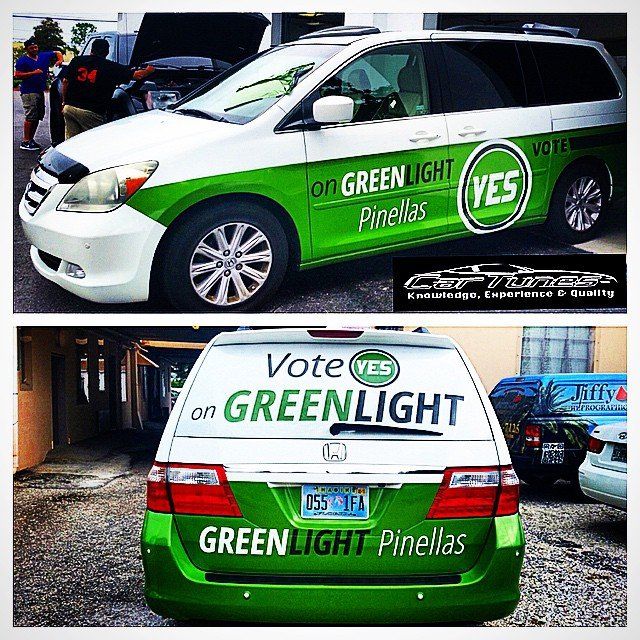 White and green Honda Odyssey with