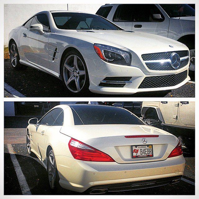 White Mercedes SL-Class coupe in a parking lot; front and rear views, sleek design.