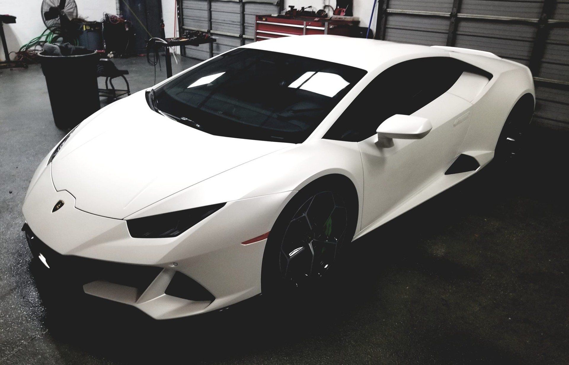 White Lamborghini in a garage.