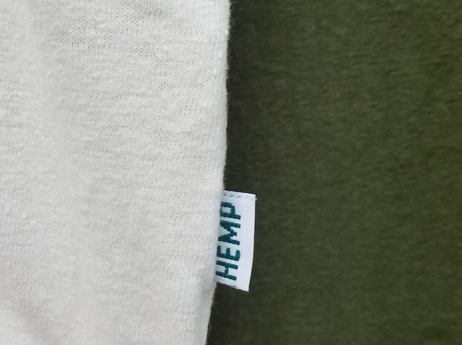 A close up of a tag on a shirt that says hemp