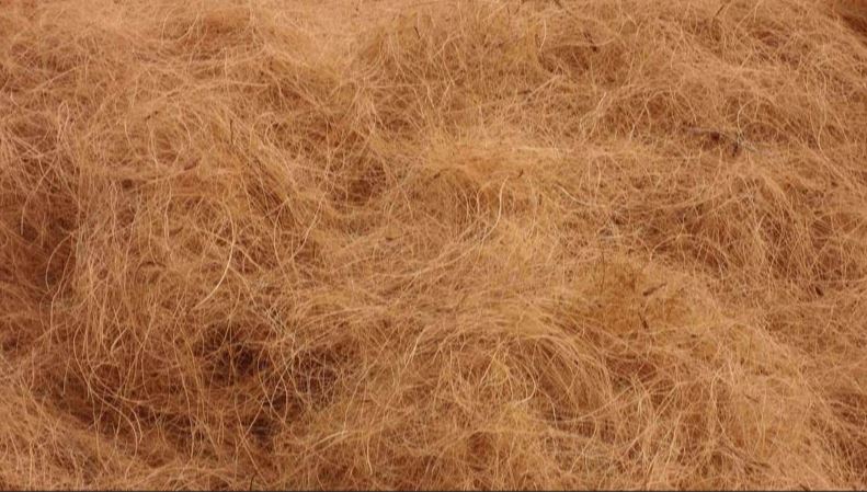 A close up of a pile of brown wool.