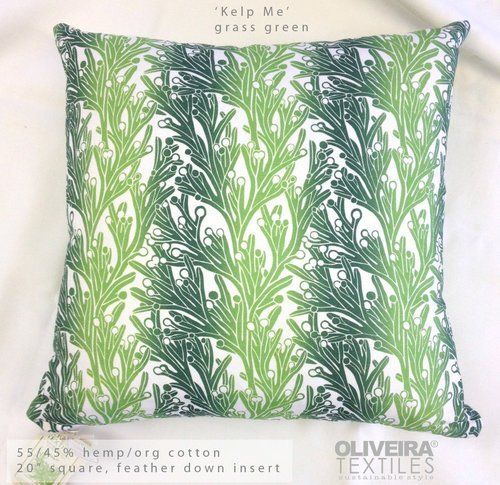 A pillow with a green and white pattern on it