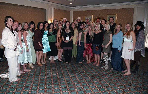 A group of people posing for a picture in a room