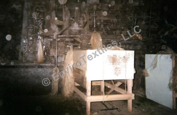 A black and white photo of a machine in a room.
