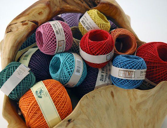 A bunch of balls of yarn with one that says hemp on it