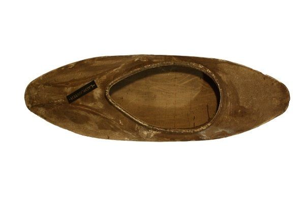 A brown oval shaped object with a white background