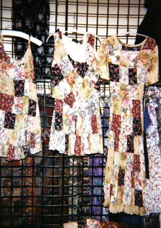 A bunch of dresses are hanging on a rack