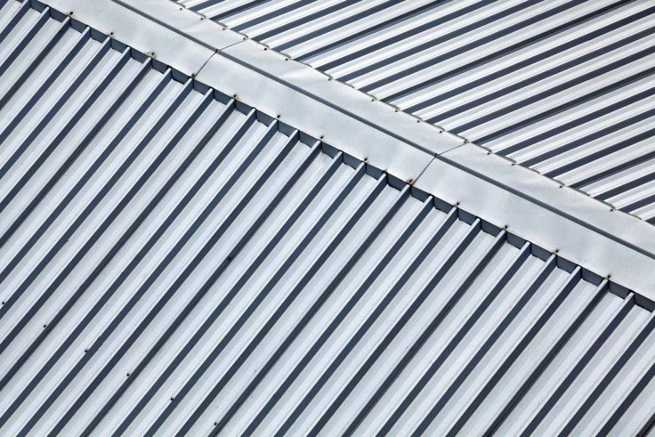 A Close Up of a Metal Roof With a Diagonal Pattern — Rhythm Roofing in North Boambee Valley, NSW