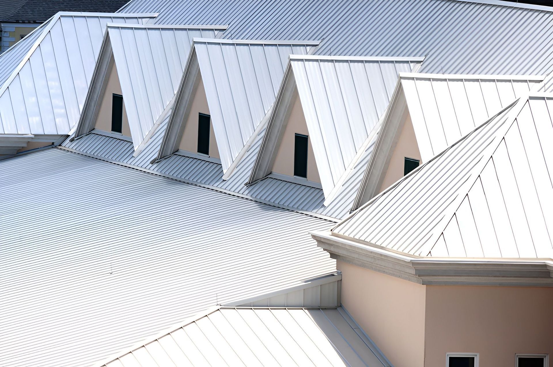 A large house with pointing roofs— Rhythm Roofing in Port Macquarie, NSW
