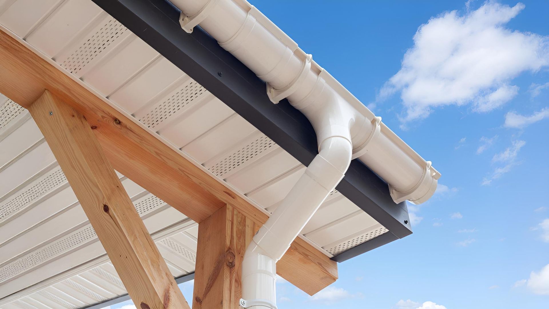 A Close Up of a Red Gutter on a Roof — Rhythm Roofing in North Boambee Valley, NSW