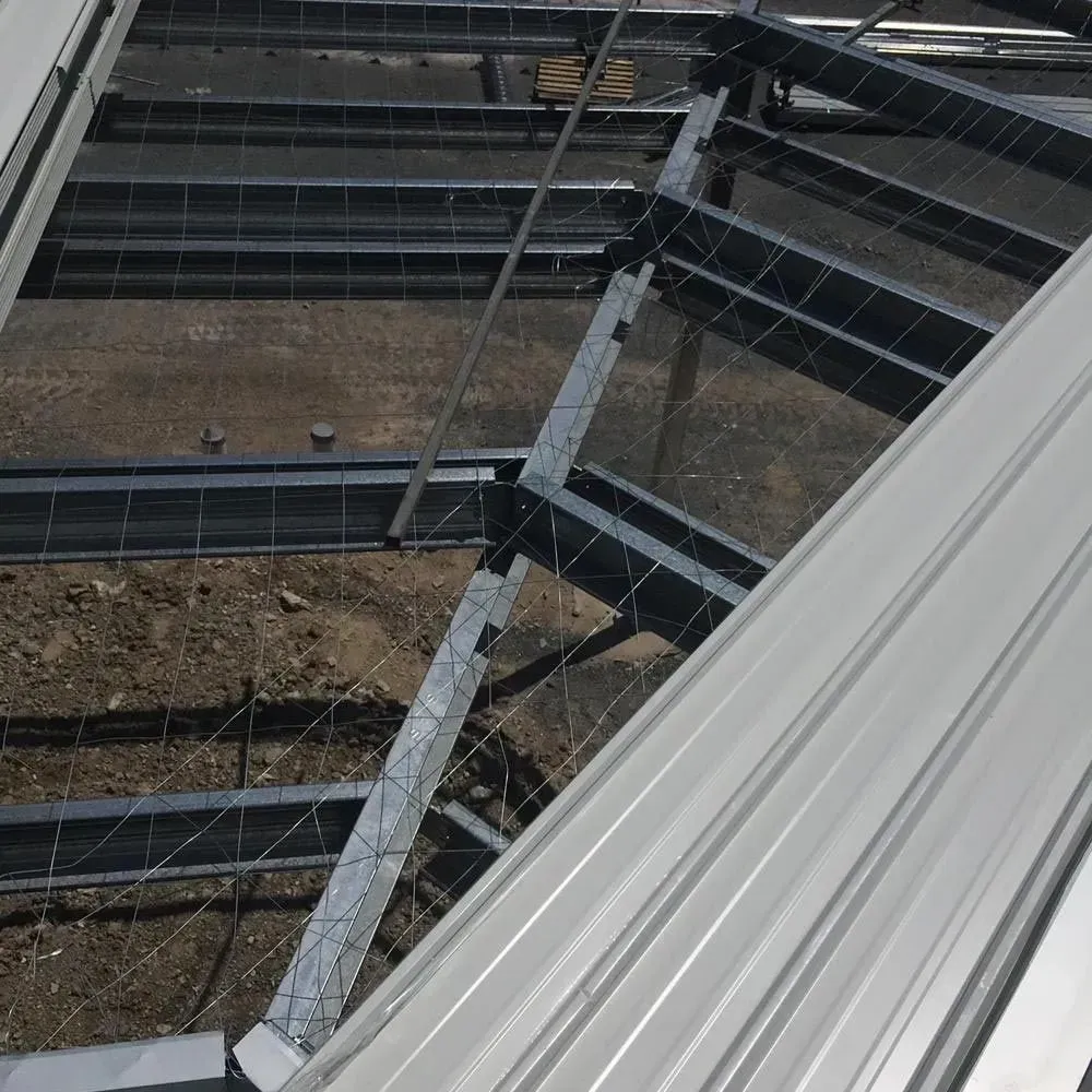 A Building Under Construction With a Metal Roof — Rhythm Roofing in North Boambee Valley, NSW
