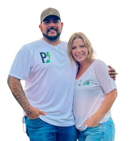 A man and a woman are posing for a picture and the man is wearing a white shirt with the letter p on it