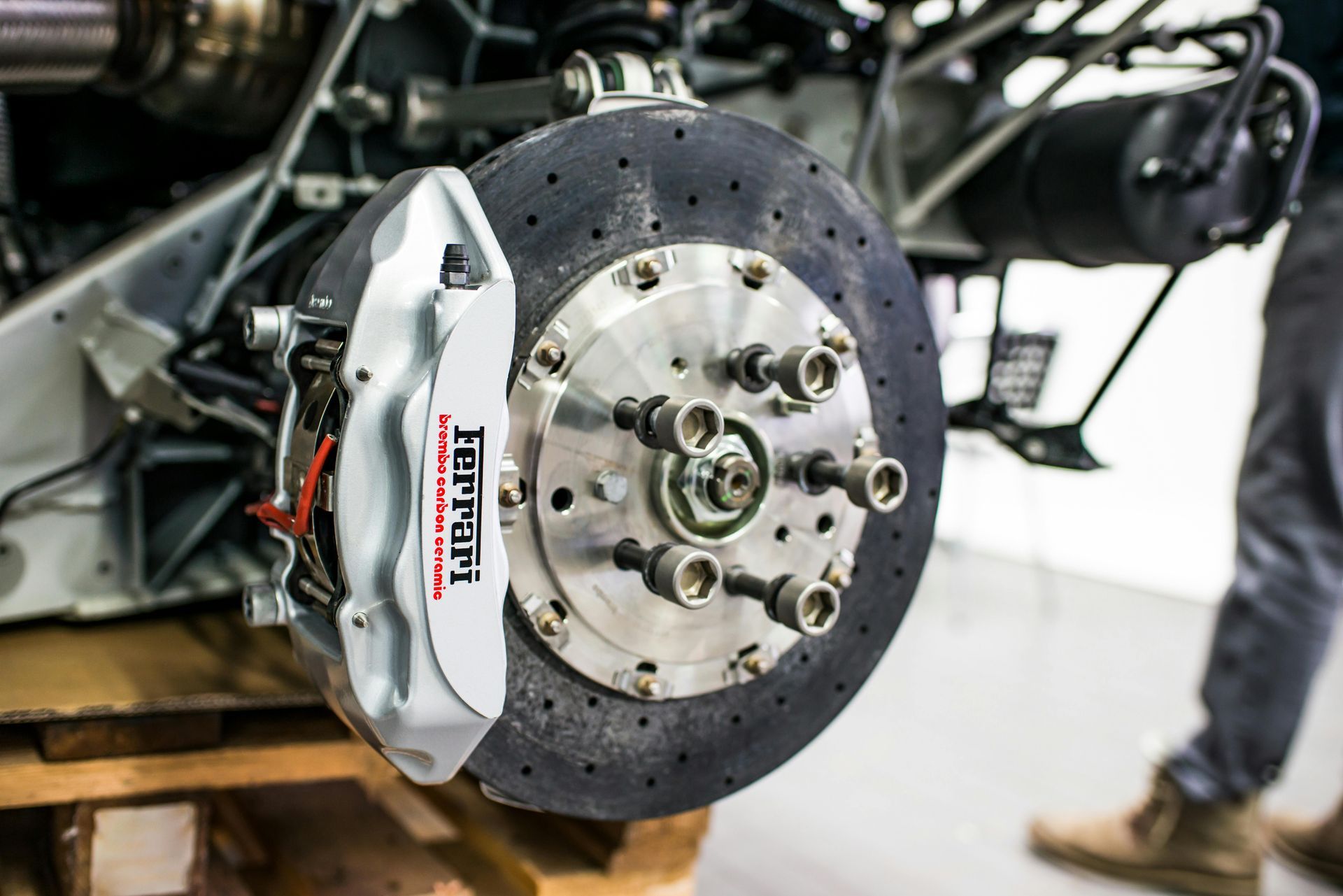 A close up of a brake disc on a ferrari car.