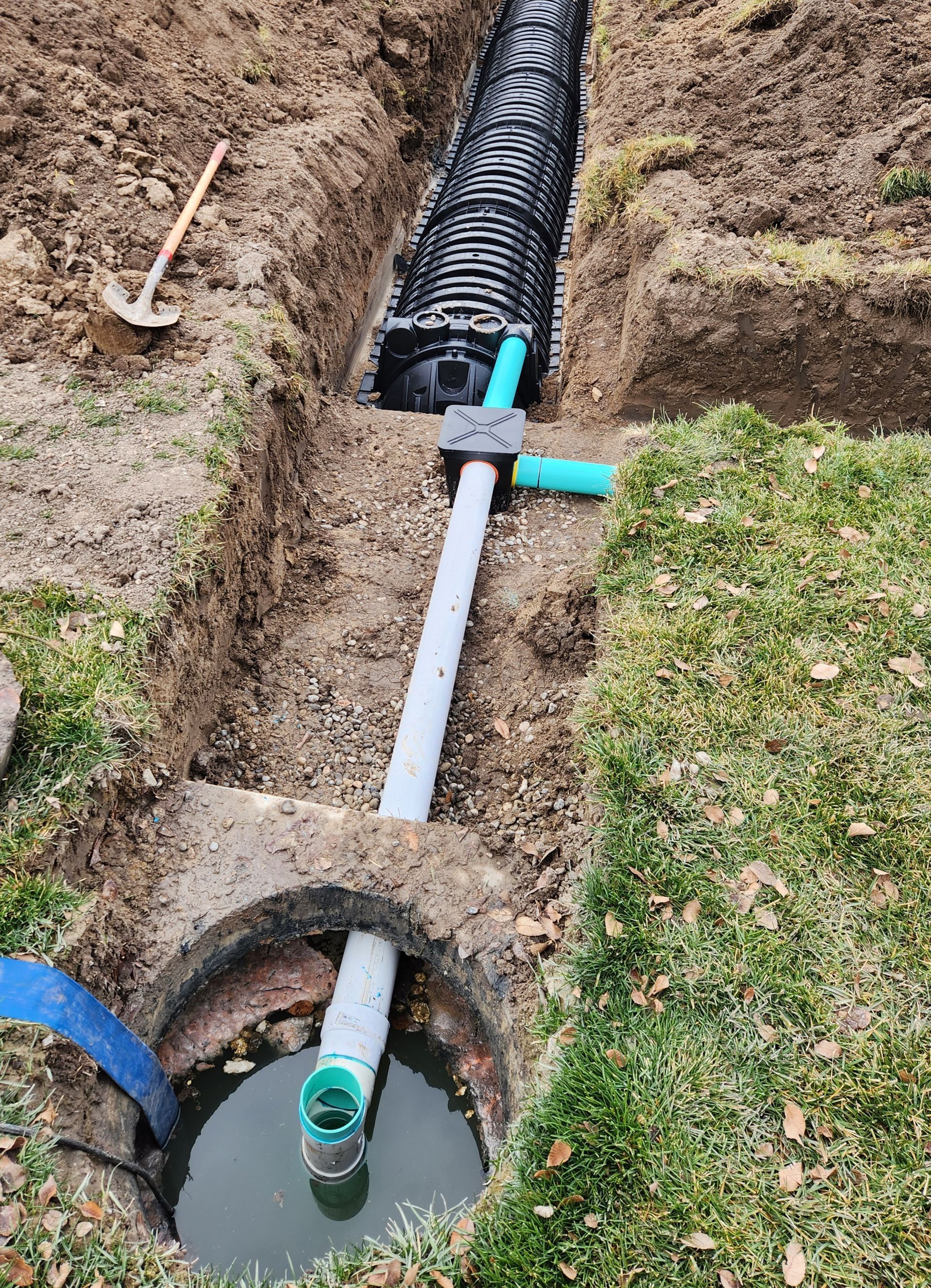 Installation of underground tank for sewage system.