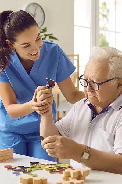 Friendly caregiver or nurse in geriatric clinic