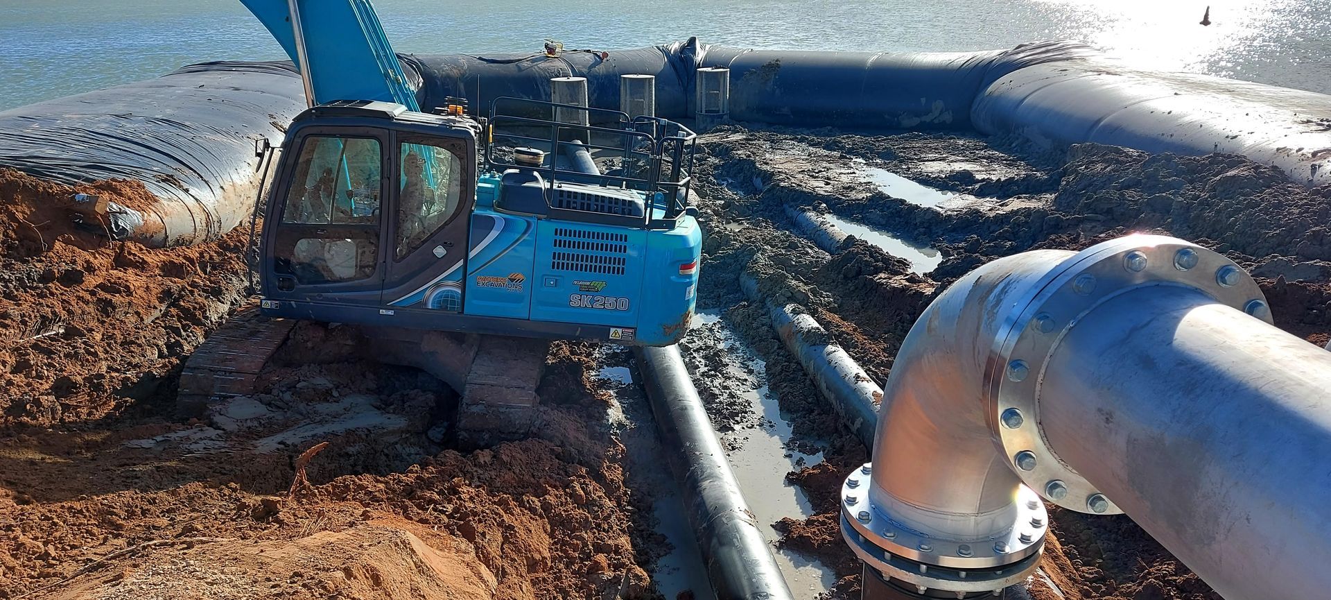 Excavator Digging Near a Pipeline— Mildura, Vic — Waters Excavations Pty Ltd