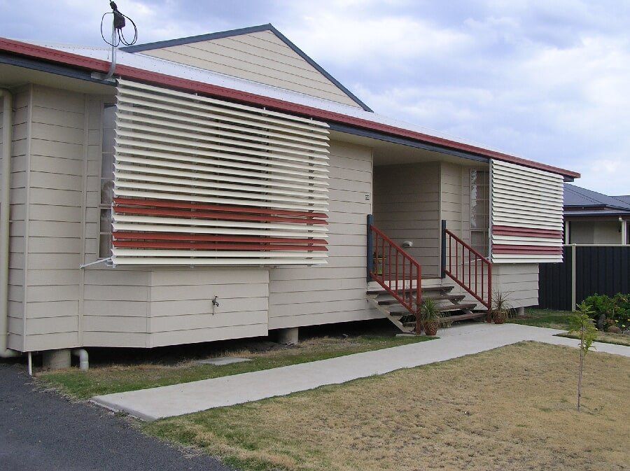 Red & Cream Aluminium Louvre Awning In A White House