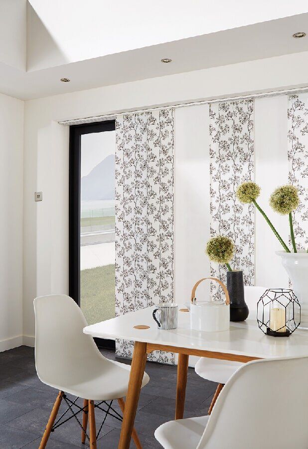 A 2nd view of the custom built blinds with a floral pattern - Deluxe Shutters & Blinds