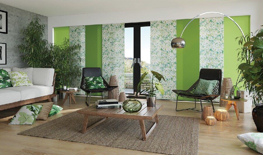 Green and floral pattern blinds in a Mackay living room - Deluxe Shutters & Blinds