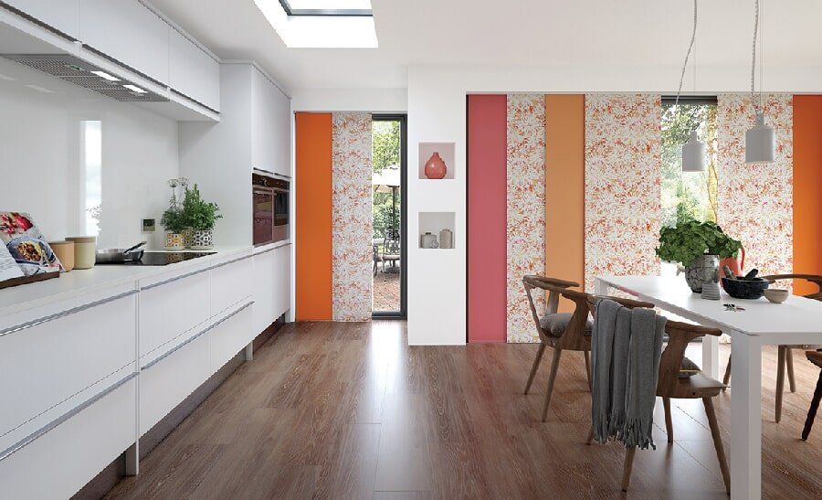 Pink, Orange and floral pattern blinds in a Mackay kitchen / dining room space - Deluxe Shutters & Blinds