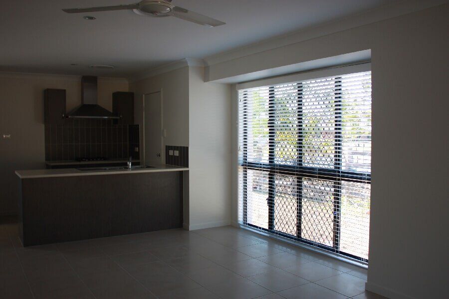Opened White Venetian Blinds in a Wide Glass Window | Venetian Blinds in Mackay