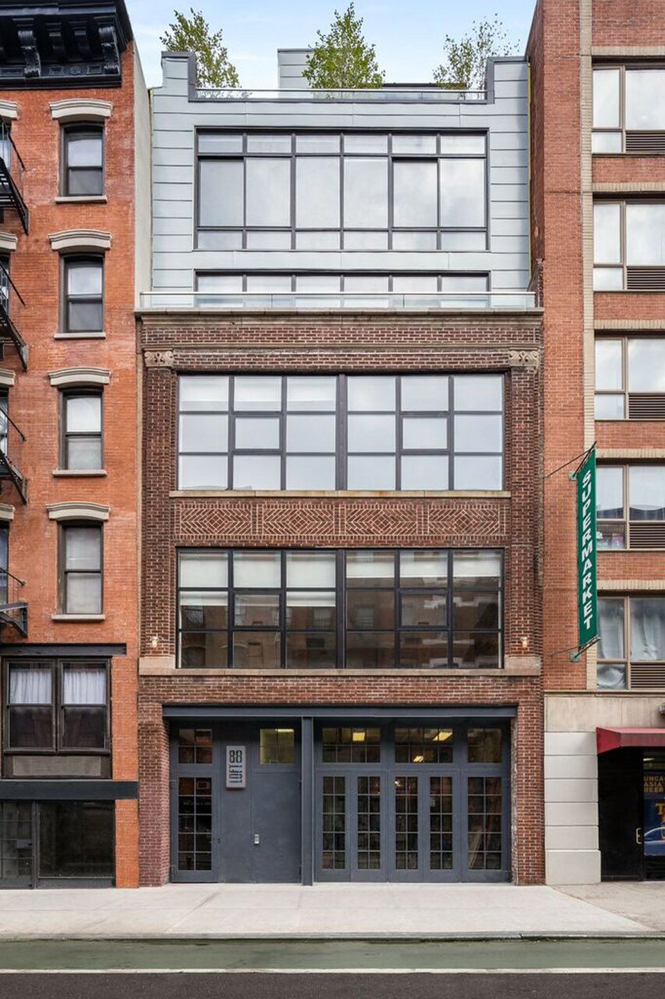 Architectural blueprint, showing detailed room layouts, lines, and symbols in black and purple on a white background.