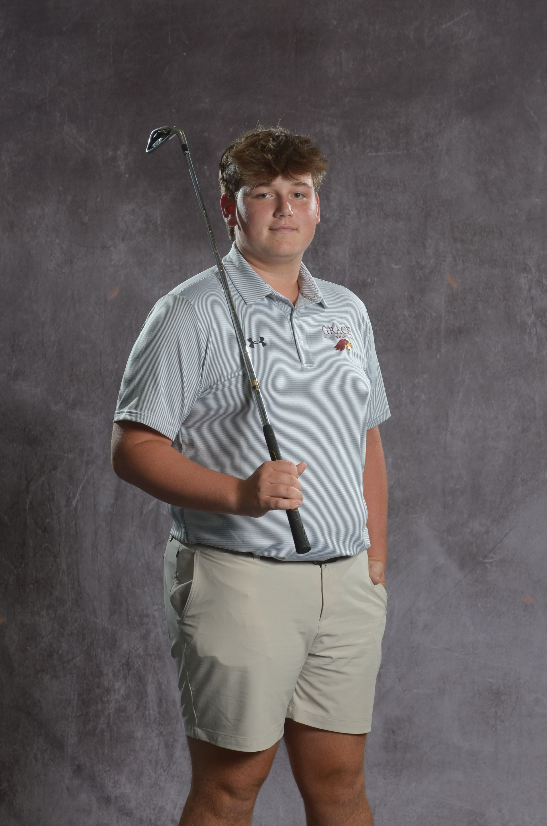 Eagle head logo in maroon and gold.