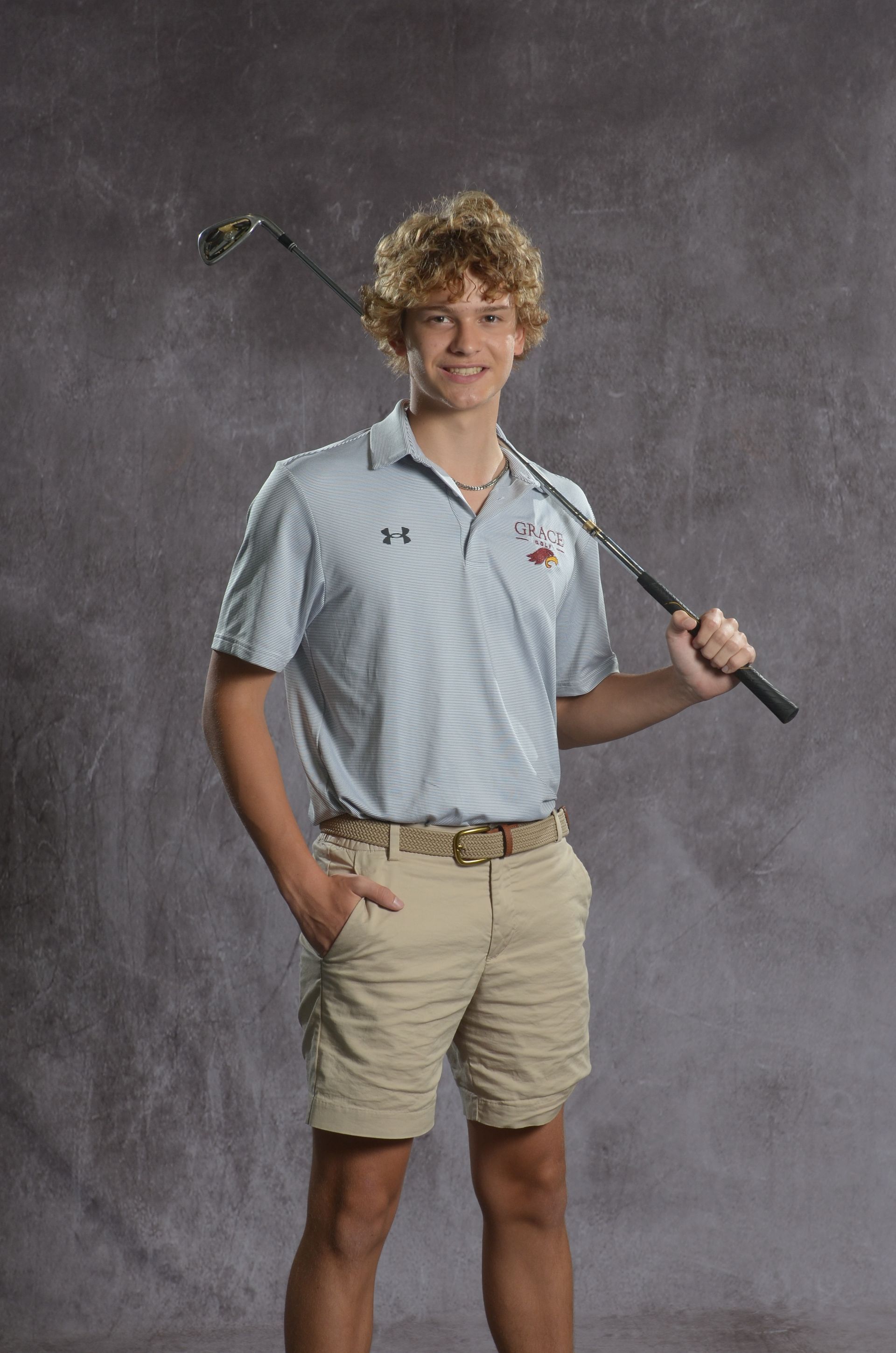 Eagle head logo in maroon and gold.