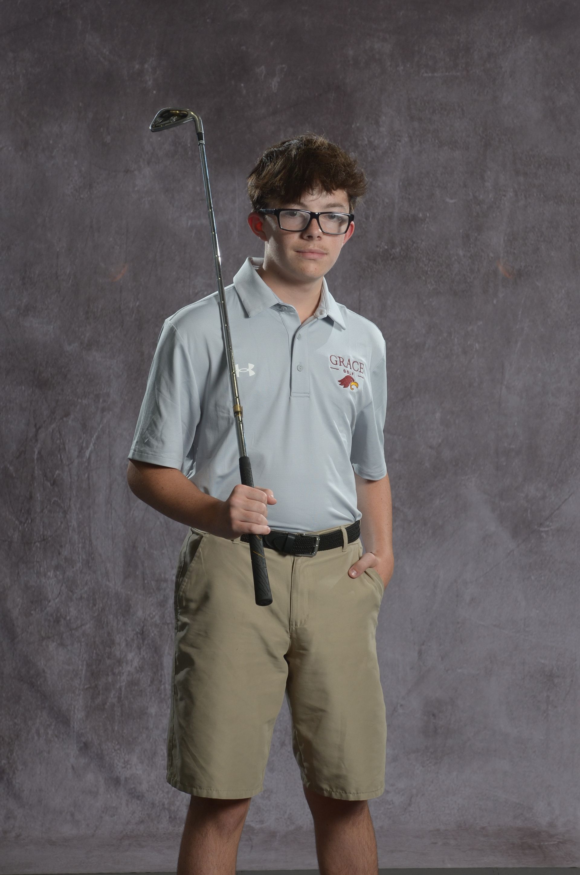 Eagle head logo in maroon and gold.