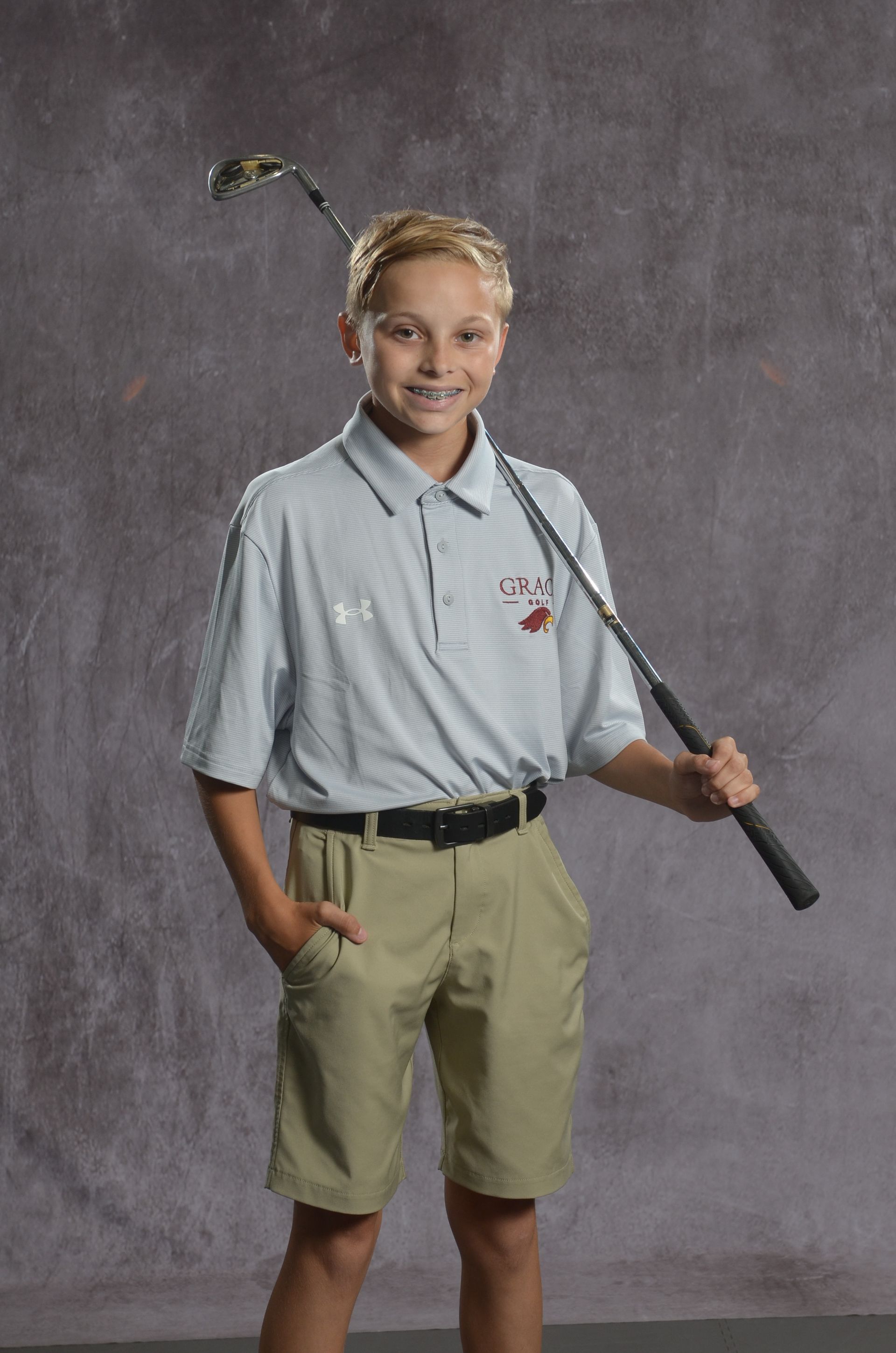 Eagle head logo in maroon and gold.