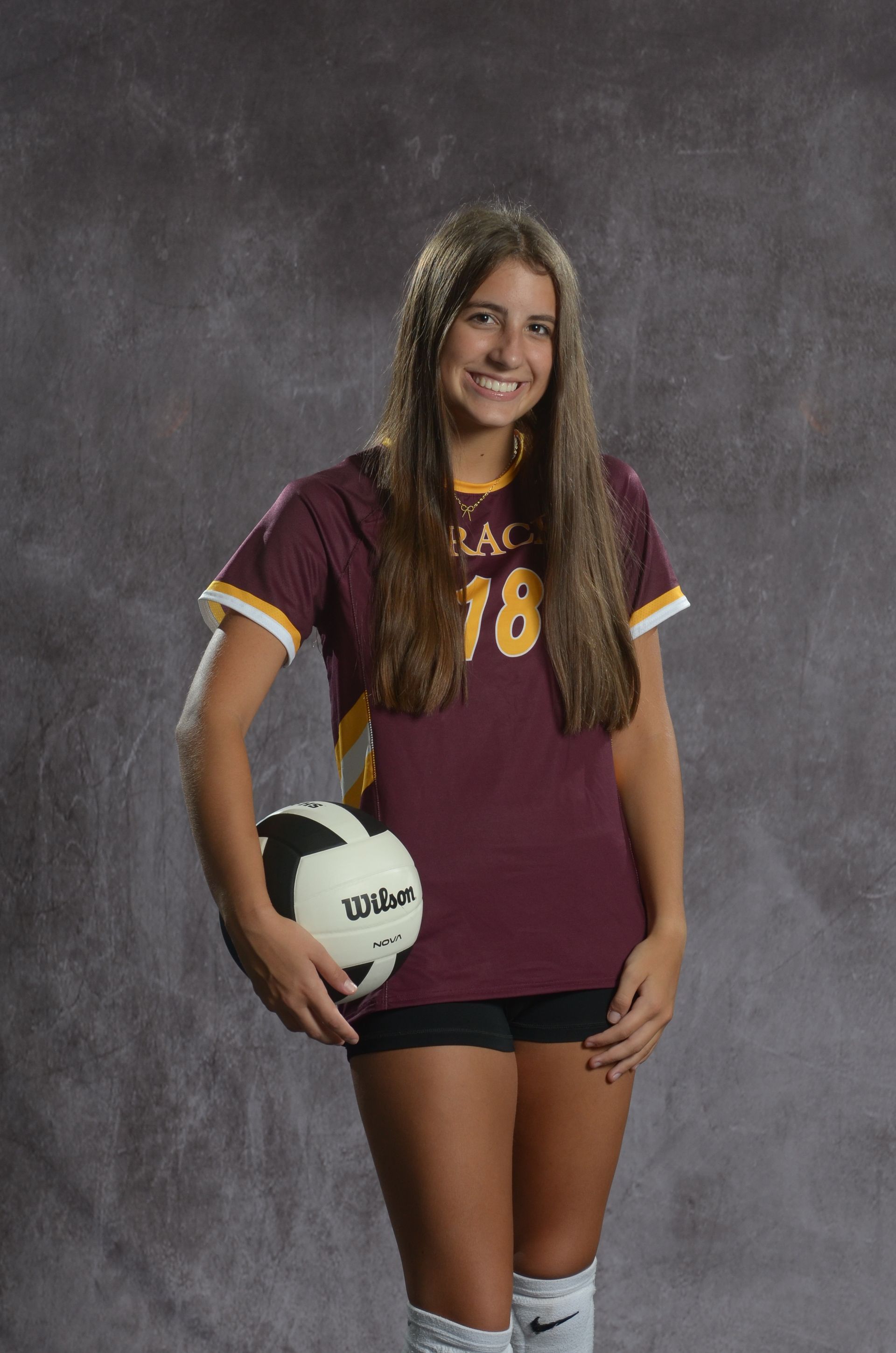 Eagle head logo, maroon and gold.