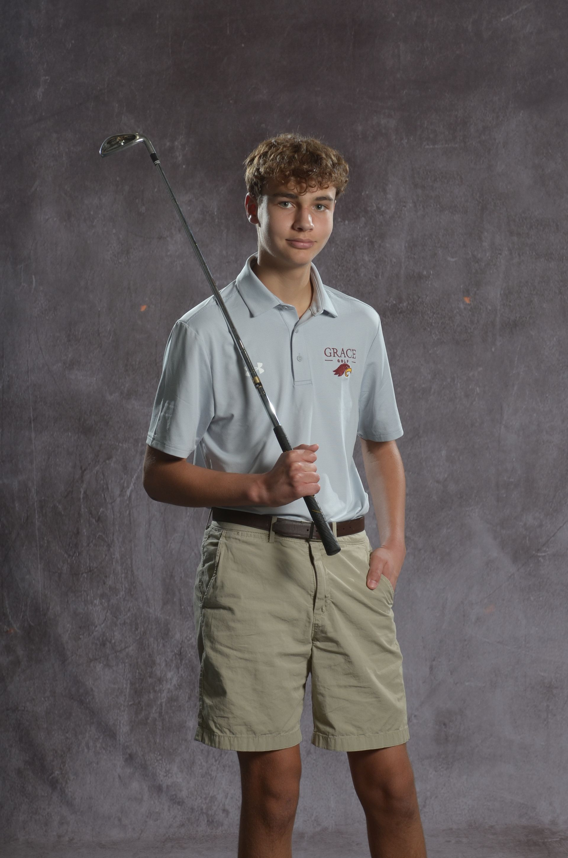 Eagle head logo in maroon and gold.