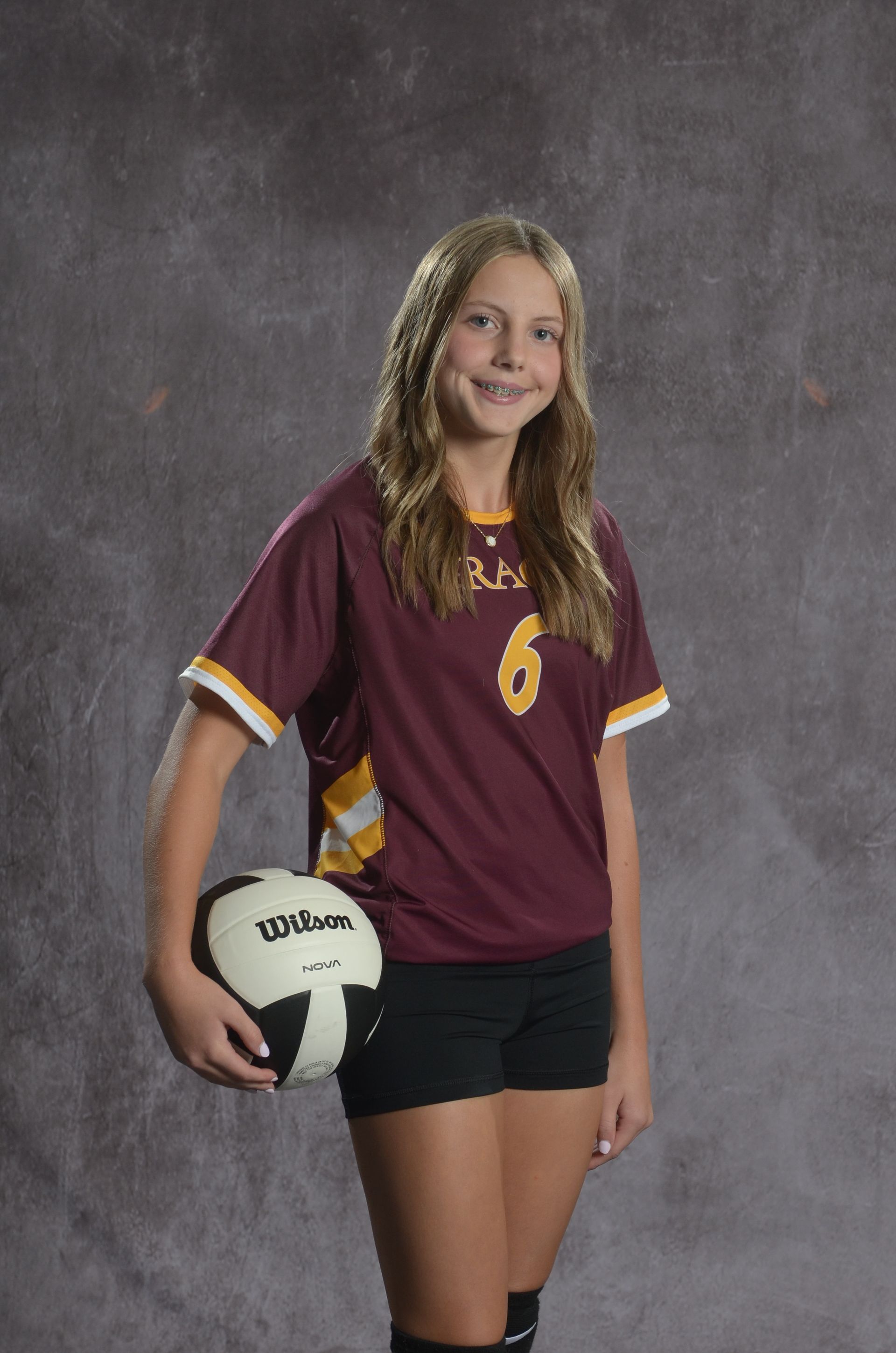 Eagle head logo, maroon and gold.