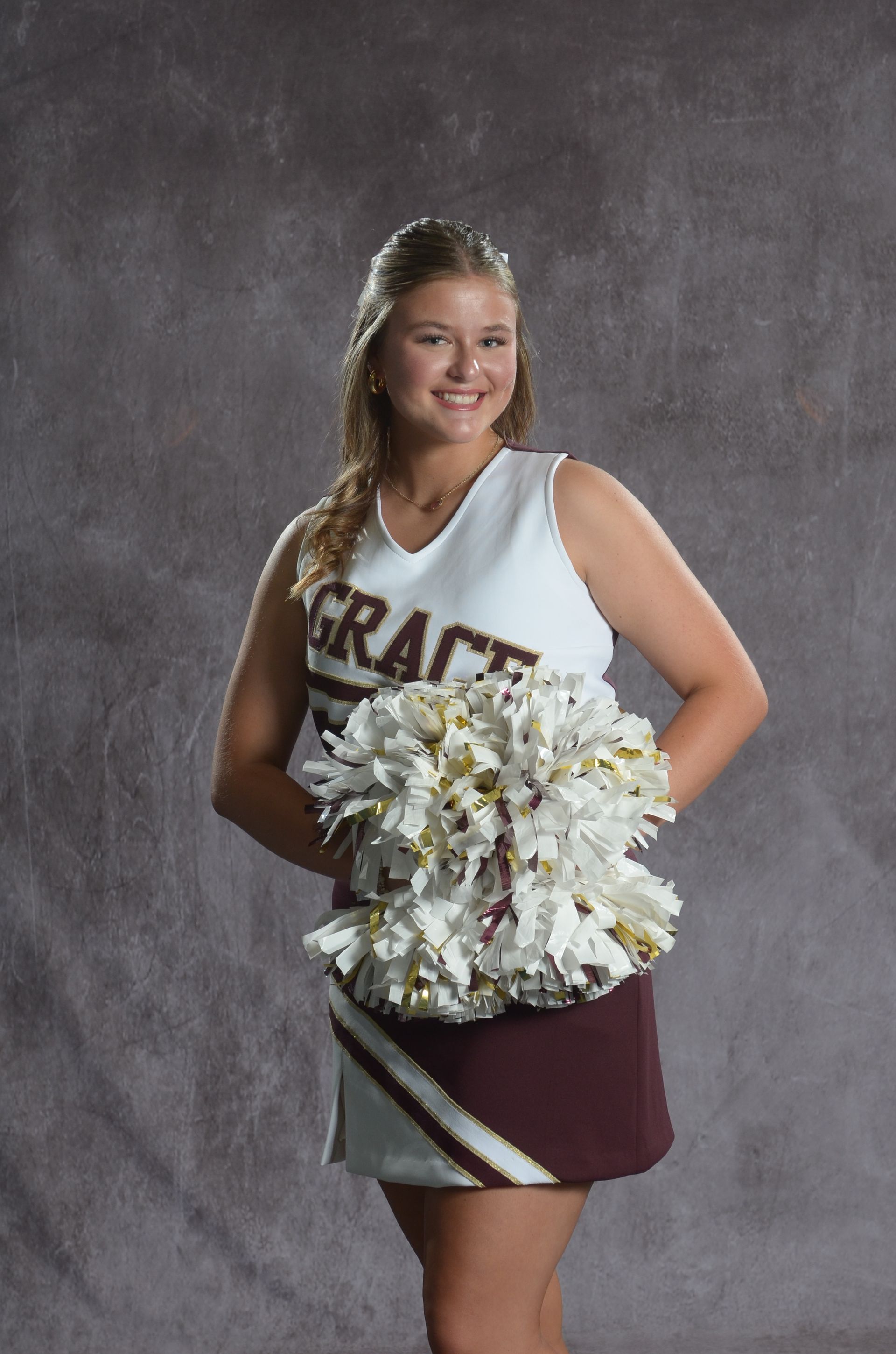 Eagle head logo in maroon and gold.