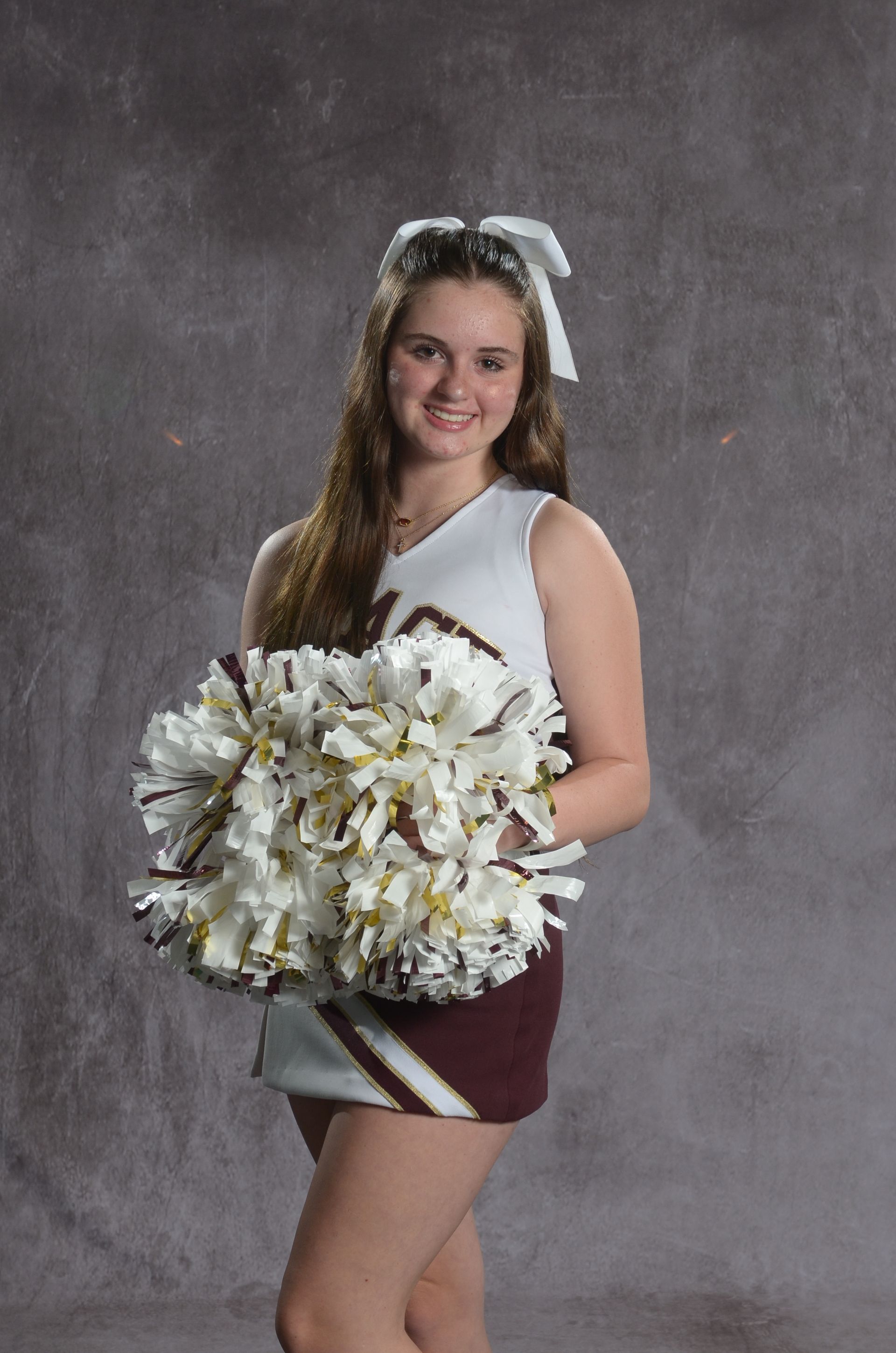 Eagle head logo in maroon and gold.