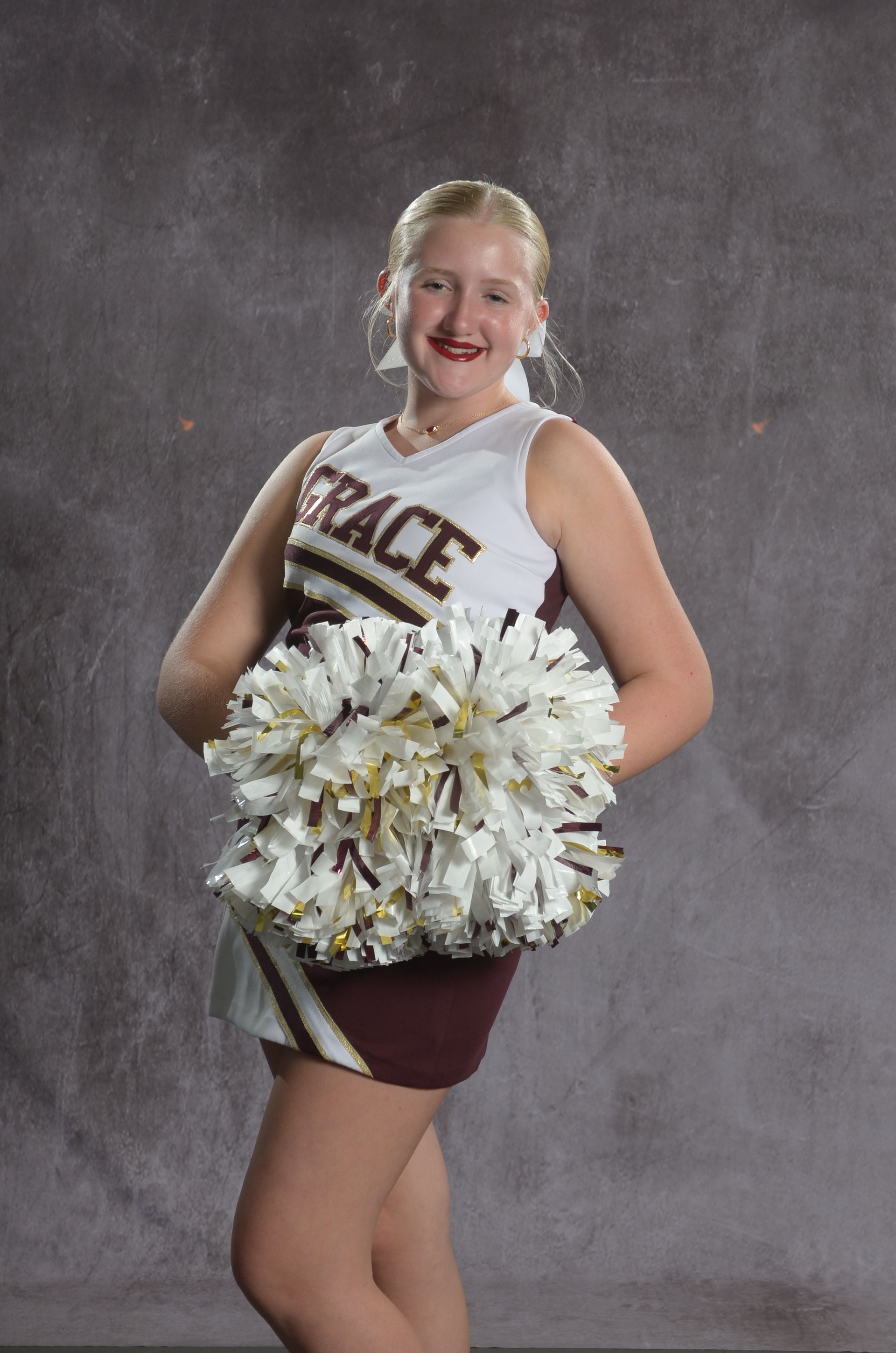 Eagle head logo in maroon and gold.