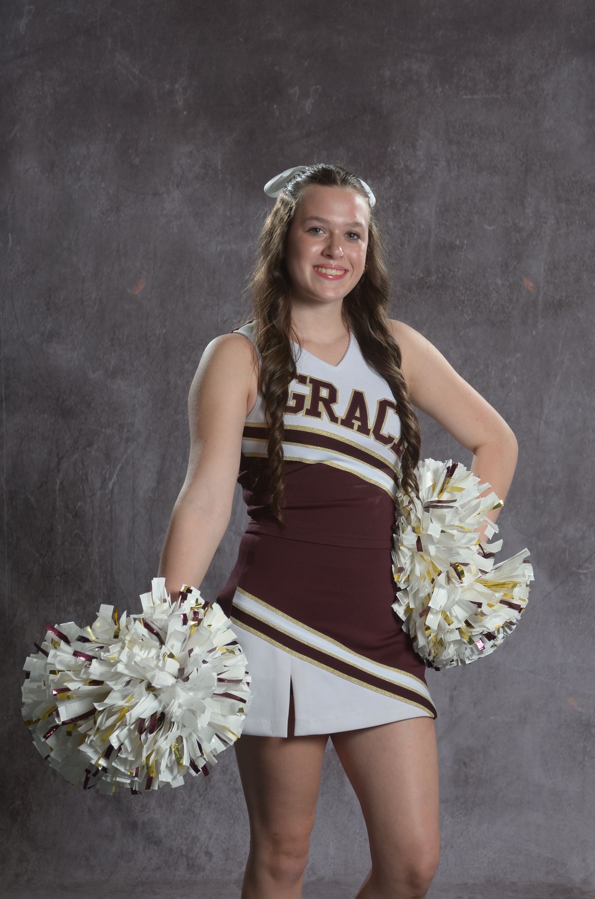 Eagle head logo in maroon and gold.