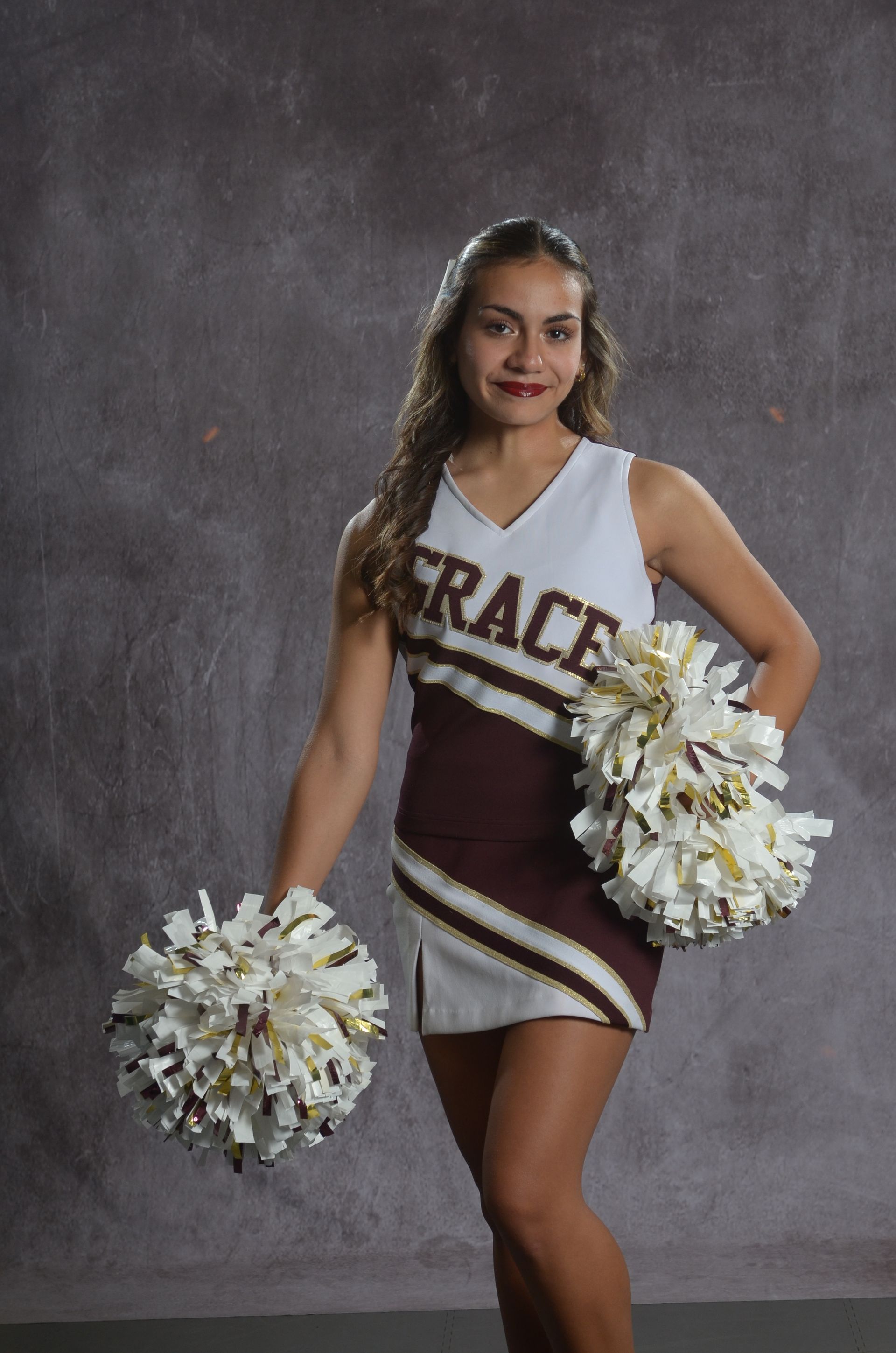 Eagle head logo in maroon and gold.