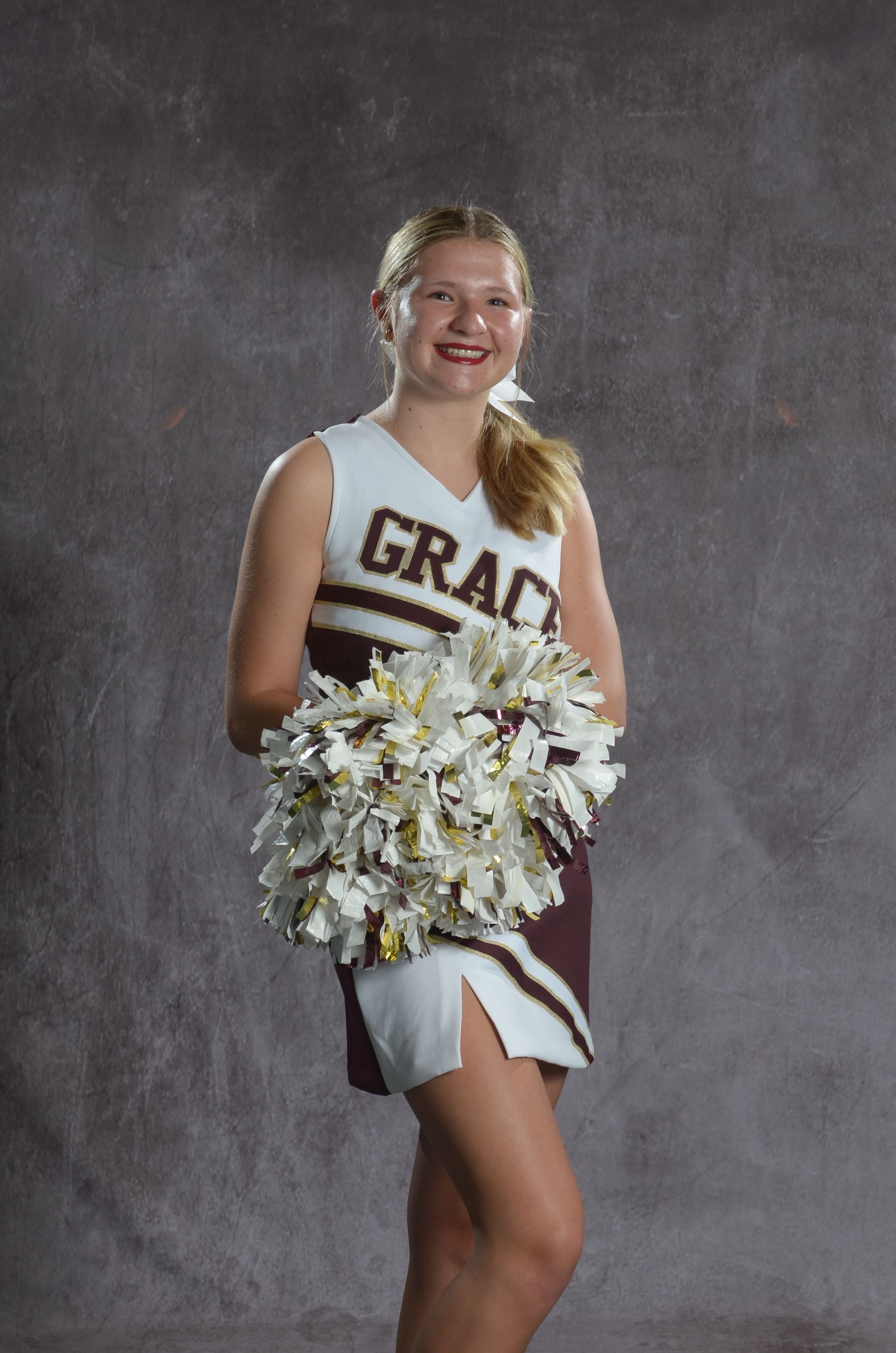 Eagle head logo in maroon and gold.