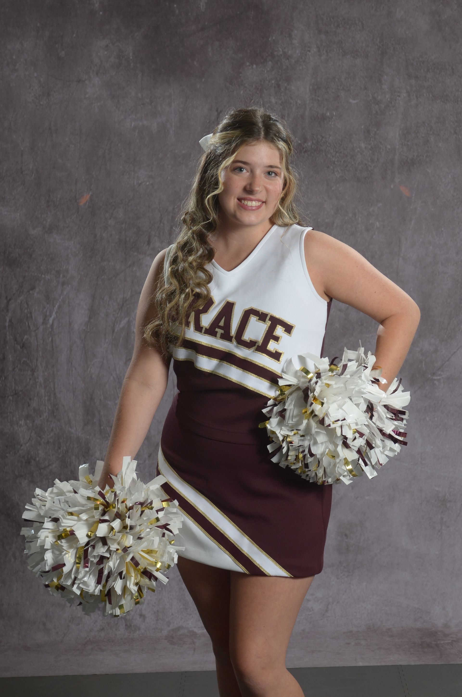 Eagle head logo in maroon and gold.